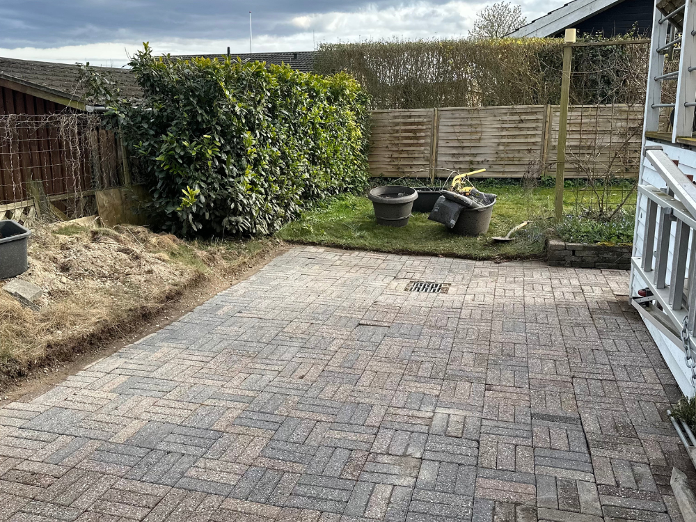 Clean patio with fresh paving stones after professional cleaning